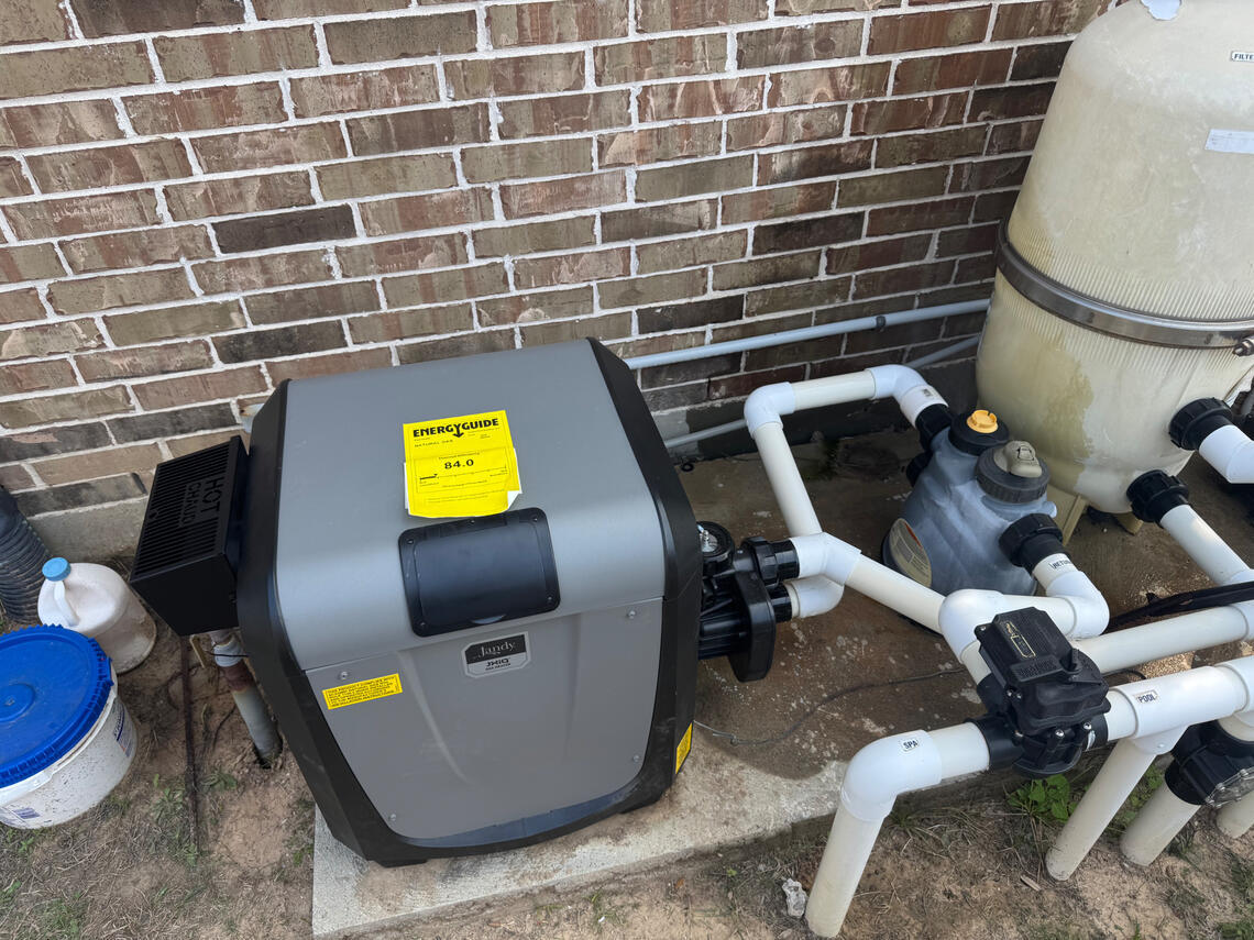 Jandy JXIQ Pool Gas Heater Install in Fulshear, Texas. Professional installation of a Jandy JXIQ gas pool heater in Fulshear, Texas, by Drew Pools.